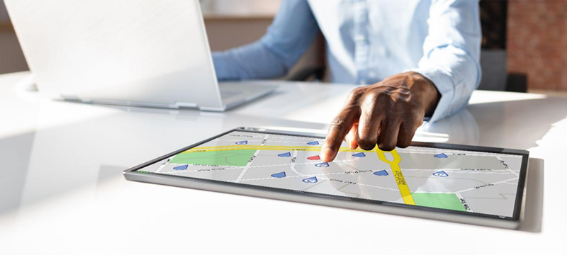 generate a photorealistic image to illustrate asset tracking with IoT technology. The output format should be 800x360px.